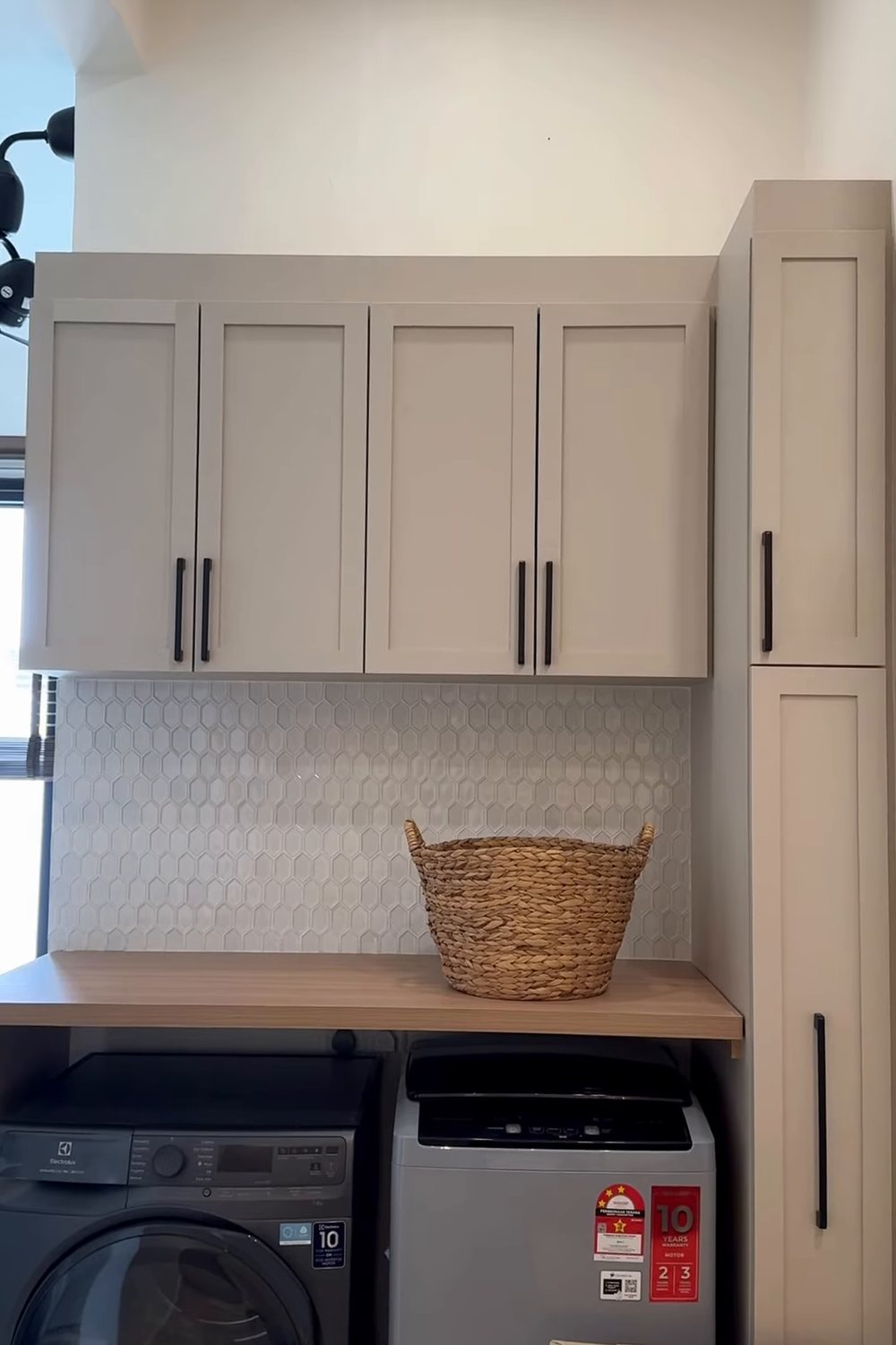 Laundry cabinets with oak worktop over washer and dryer, wall cabinets and tall cabinet with folding ironing board, Taman Daiman, Johor Bahru