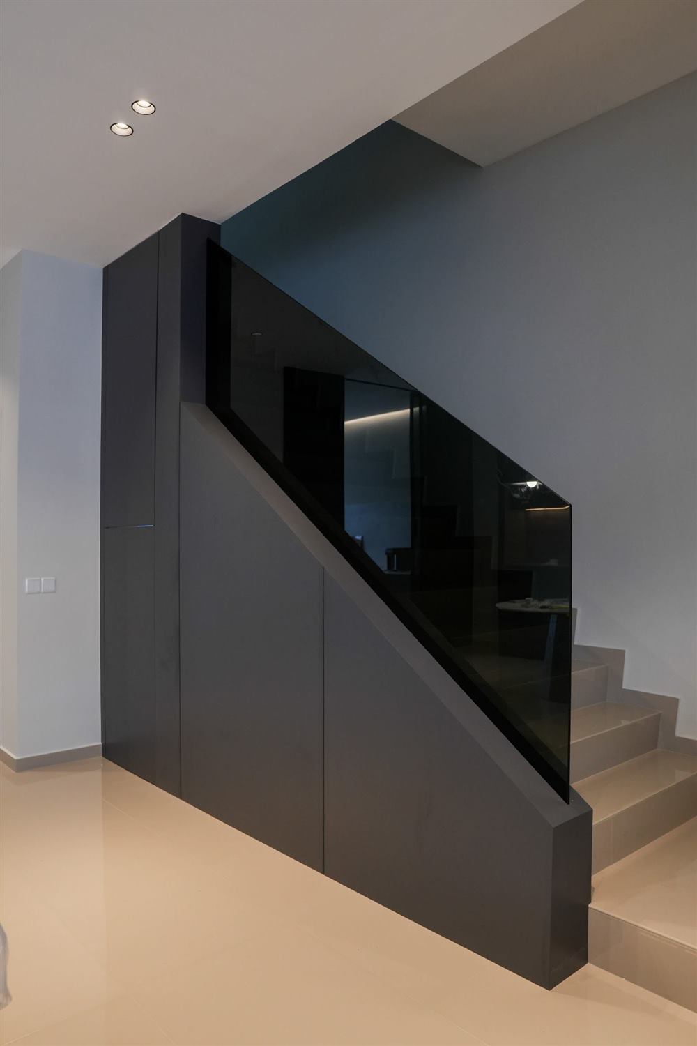 Black under-staircase storage cabinet with glass balustrade, Eco Botanic, Johor