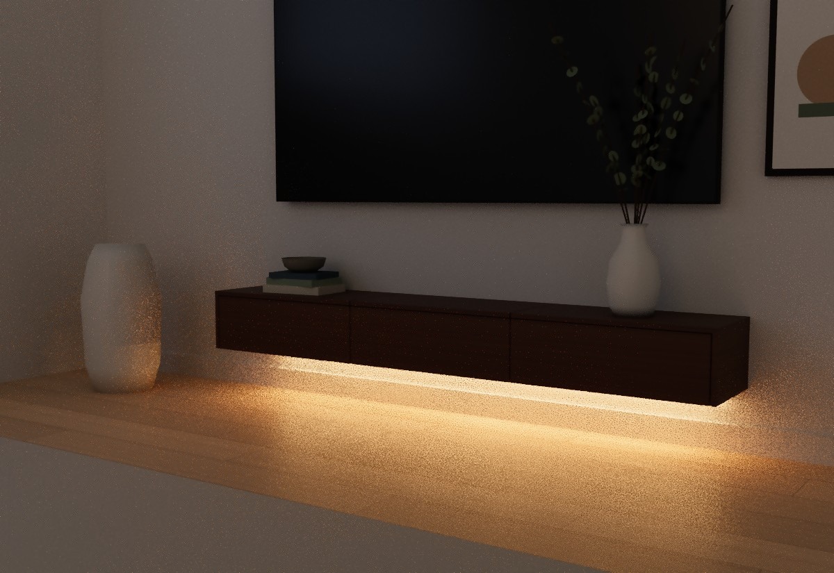 Floating TV console at night with the warm under-cabinet LED strip lighting the wall and floor